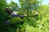 Einfamilienhaus in einem Gartenparadies mit eigenem Bachlauf - Gartenansicht